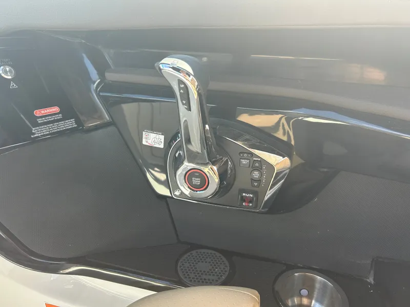 Slide: The Image of Close-up of the throttle control on a 2027 Sea Ray SLX 260 boat. - 22