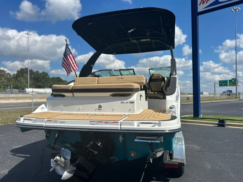 Slide: The Image of The image shows a 2027 Sea Ray SLX 260 boat with an American flag. - 6