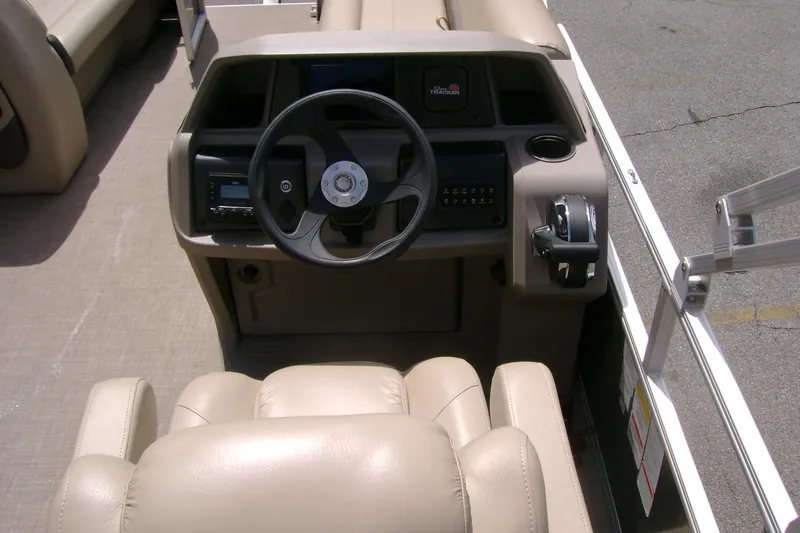 Slide: The Image of 2025 Sun Tracker Party Barge 18 DLX helm with steering wheel and controls. - 5