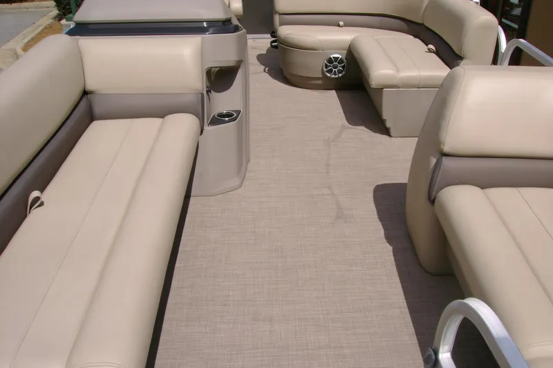 Slide: The Image of Interior of 2025 Sun Tracker Party Barge 18 DLX with beige seating and carpet. - 8