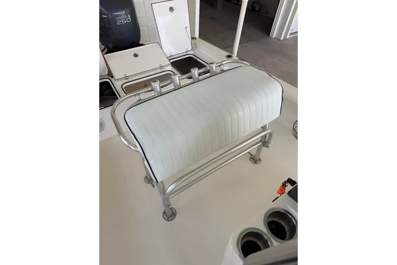 Slide: The Image of White cushioned seat on a 2006 BlackJack 224 boat with Yamaha 250 engine. - 14