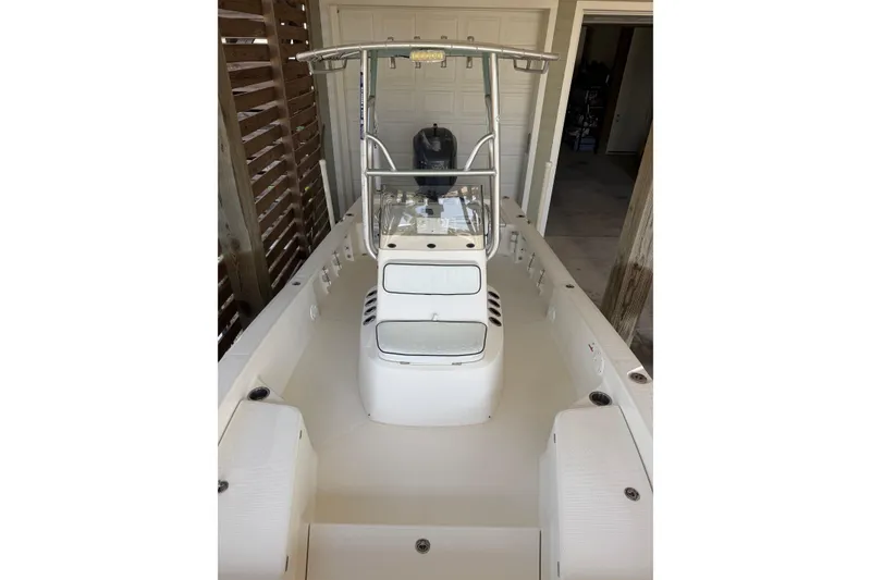 Slide: The Image of 2006 BlackJack 224 boat interior with center console and seating. - 16