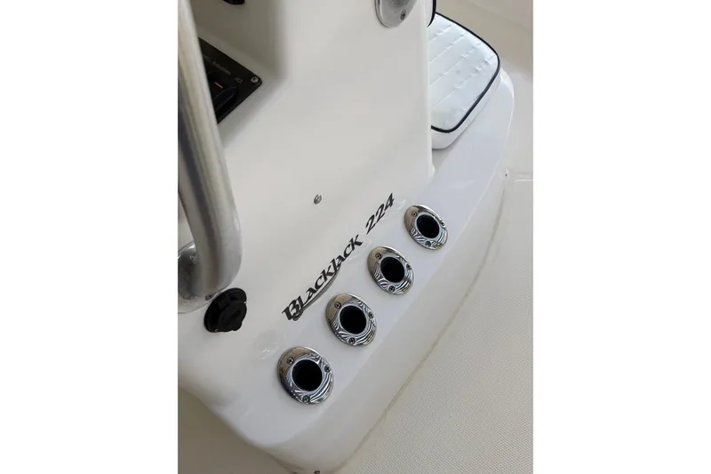 Slide: The Image of 2006 BlackJack 224 boat console with chrome fittings and logo detail. - 24