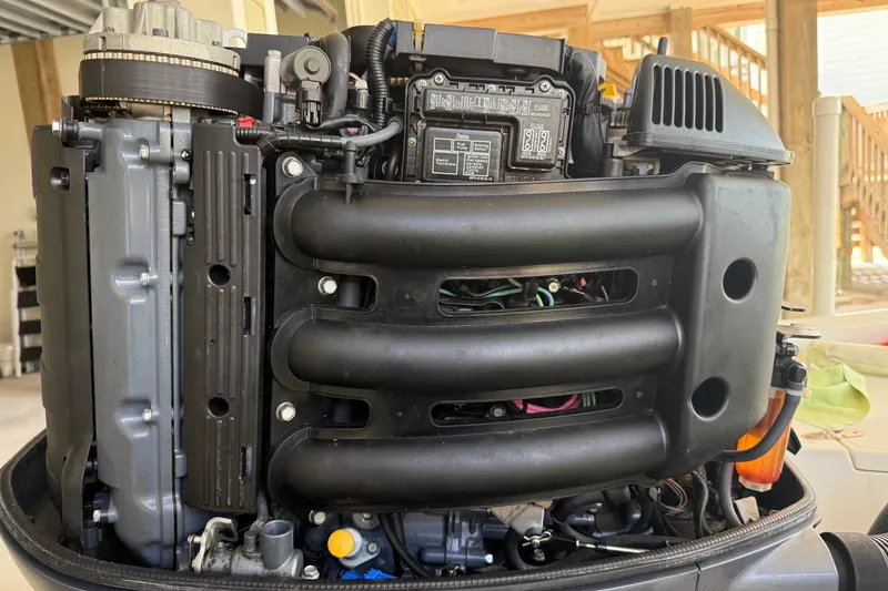 Slide: The Image of Close-up of a 2006 BlackJack 224 engine, showcasing intricate mechanical components. - 33