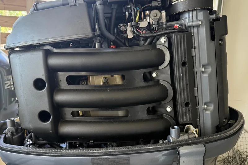 Slide: The Image of Close-up of a 2006 BlackJack 224 engine, showcasing intricate mechanical components. - 34