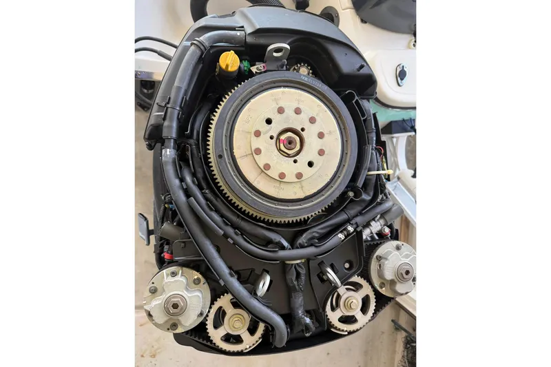 Slide: The Image of Close-up of a 2006 BlackJack 224 engine, showcasing intricate mechanical components. - 35