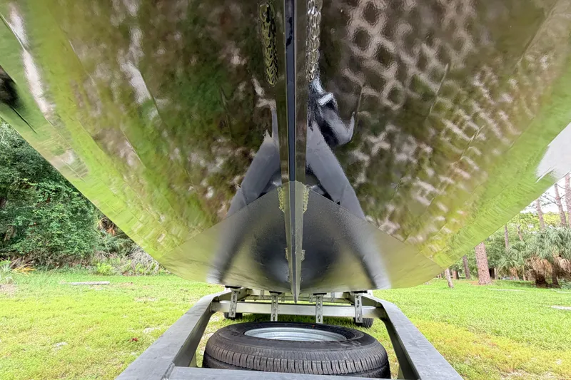 Slide: The Image of Underside view of 2024 Prodigy 1854 boat on trailer, showcasing hull design. - 10