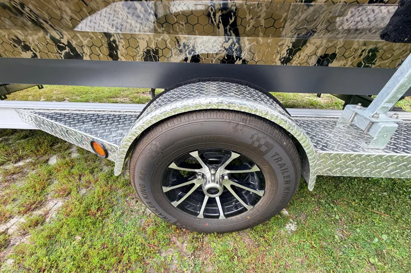 Slide: The Image of Trailer wheel with diamond plate fender on 2024 Prodigy 1854 model. - 14