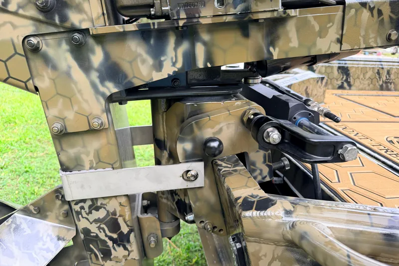 Slide: The Image of Close-up of 2024 Prodigy 1854 machinery with camouflage pattern and mechanical components. - 34