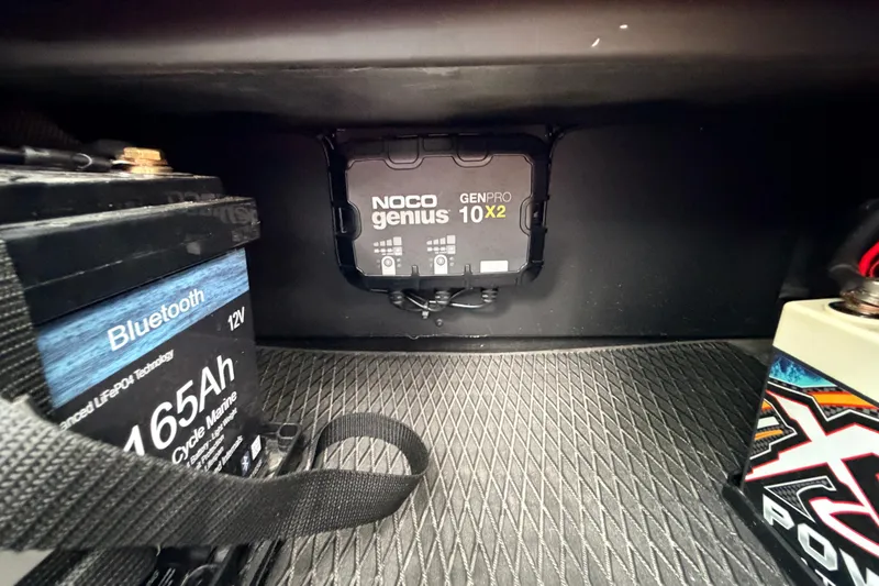 Slide: The Image of Battery compartment with NOCO Genius GENPRO 10X2 charger in Prodigy 1854, 2024 model. - 44