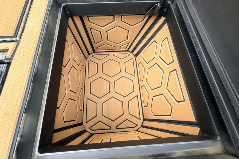 Slide: The Image of Storage compartment with geometric pattern in 2024 Prodigy 1854 model. - 49