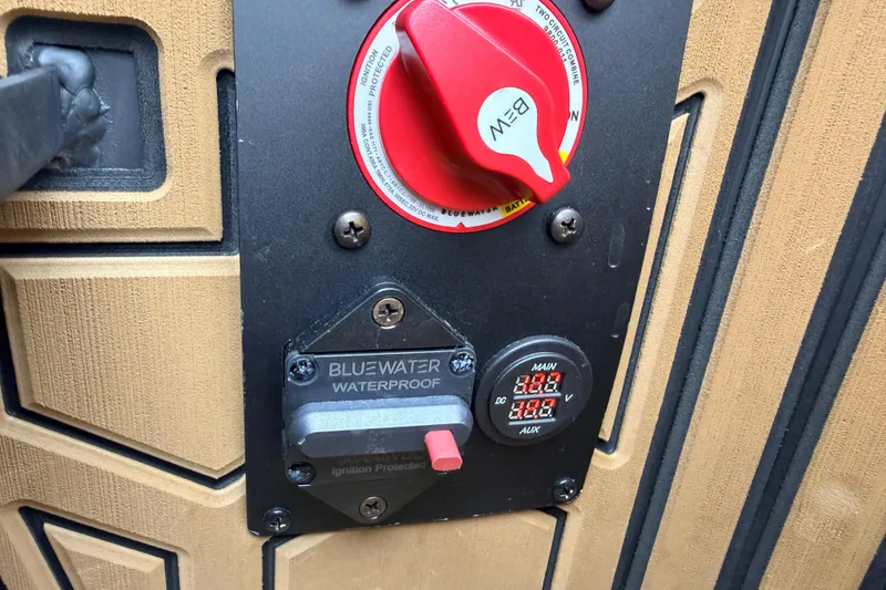 Slide: The Image of Red ignition switch and voltage display on Prodigy 1854, 2024 model, waterproof panel. - 56