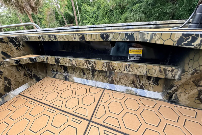 Slide: The Image of Interior of 2024 Prodigy 1854 boat with camouflage design and geometric flooring. - 66
