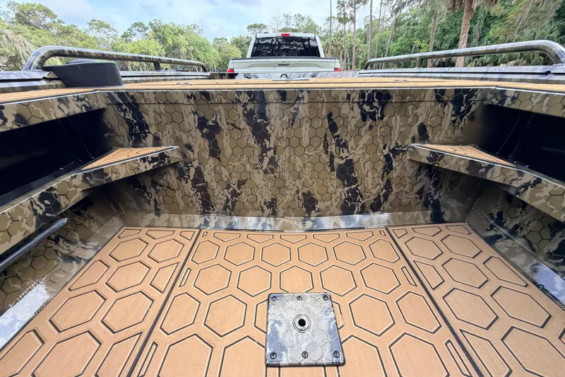 Slide: The Image of 2024 Prodigy 1854 boat interior with camouflage design and hexagonal patterned flooring. - 67