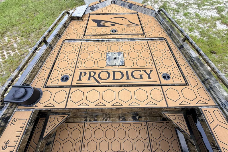 Slide: The Image of 2024 Prodigy 1854 boat deck with honeycomb pattern and logo, featuring durable design. - 68