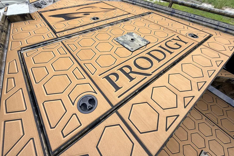 Slide: The Image of Deck of 2024 Prodigy 1854 boat with hexagonal pattern and logo. - 69