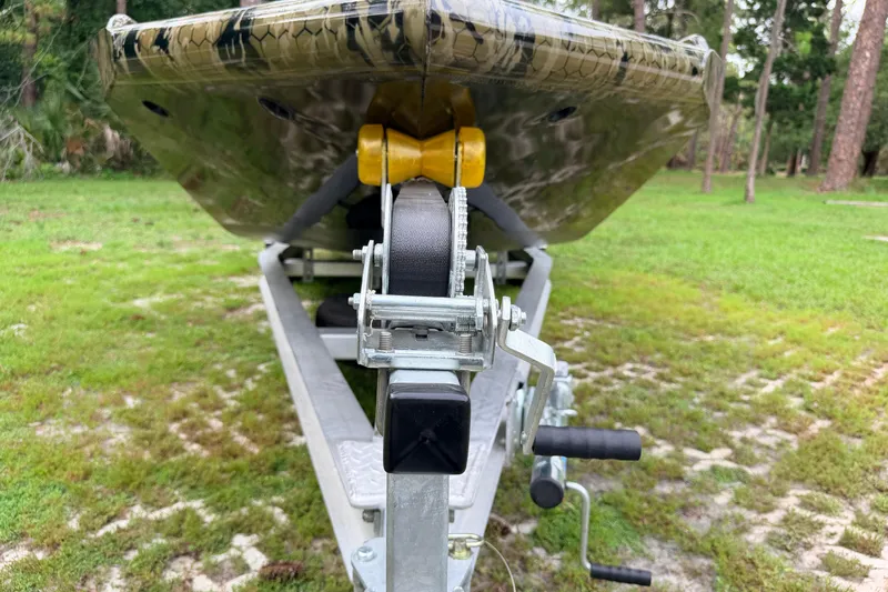 Slide: The Image of Trailer hitch of 2024 Prodigy 1854 boat on grassy area. - 7