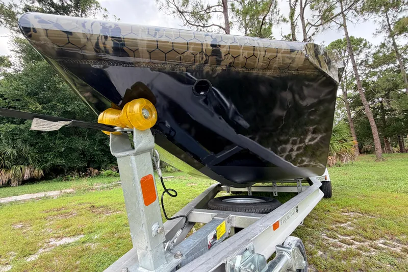 Slide: The Image of 2024 Prodigy 1854 boat on trailer, showcasing sleek design and durable construction. - 9