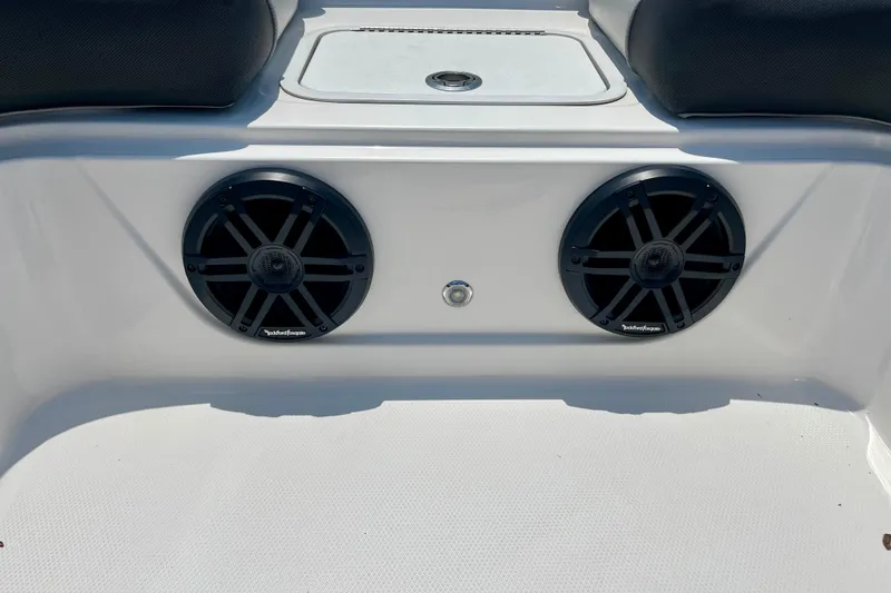 Slide: The Image of 2024 Hurricane Sundeck Sport 218 OB boat speakers and seating area. - 17