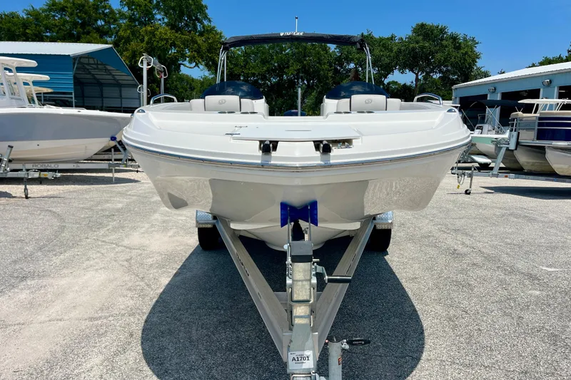 Slide: The Image of 2024 Hurricane Sundeck Sport 218 OB boat on trailer, parked outdoors. - 8