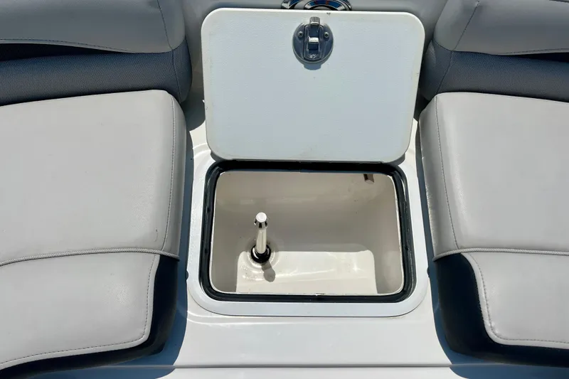 Slide: The Image of 2024 Hurricane Sundeck Sport 218 OB boat storage compartment with open hatch. - 15