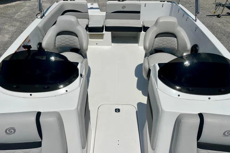 Slide: The Image of 2024 Hurricane Sundeck Sport 218 OB interior with seating and helm, showcasing modern design. - 18