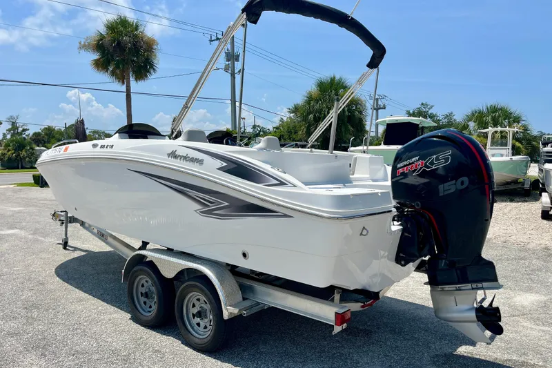 Slide: The Image of 2024 Hurricane Sundeck Sport 218 OB boat on trailer with Mercury Pro XS engine. - 3