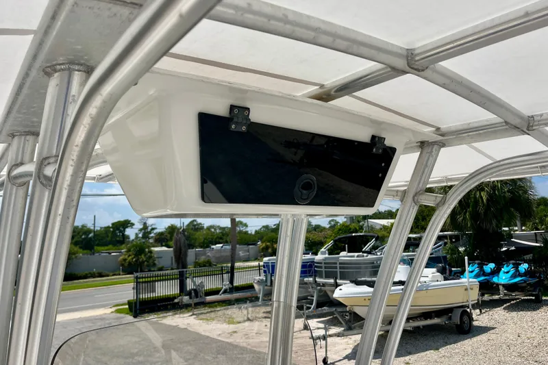 Slide: The Image of 2016 Robalo R222 Center Console boat with T-top storage compartment. - 11