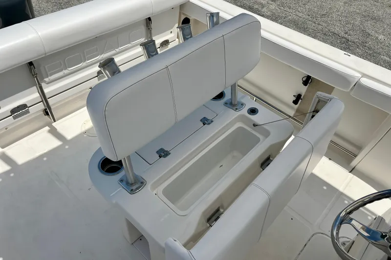 Slide: The Image of 2016 Robalo R222 Center Console boat interior with seating and storage compartments. - 13