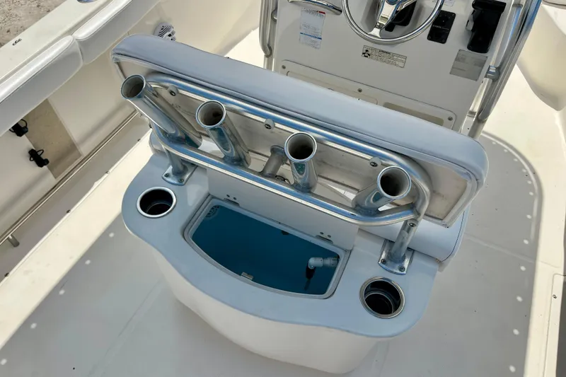 Slide: The Image of 2016 Robalo R222 Center Console boat with rod holders and storage compartment. - 14