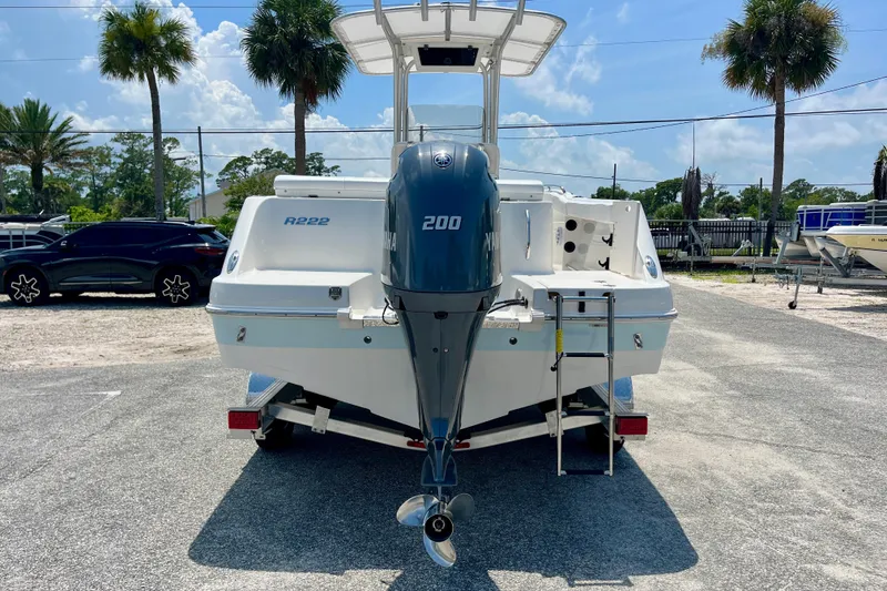 Slide: The Image of 2016 Robalo R222 Center Console boat with Yamaha 200 engine, parked outdoors. - 4