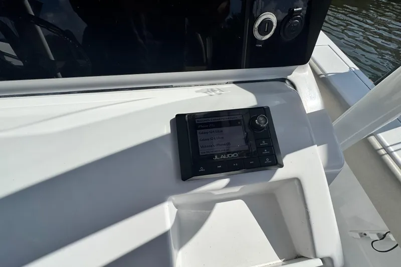 Slide: The Image of Control panel on a 2021 Sportsman Masters 267 Bay Boat, featuring JL Audio system. - 12