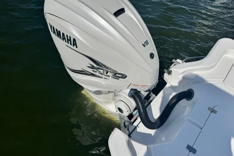 Slide: The Image of 2021 Sportsman Masters 267 Bay Boat with Yamaha V8 outboard engine on water. - 24