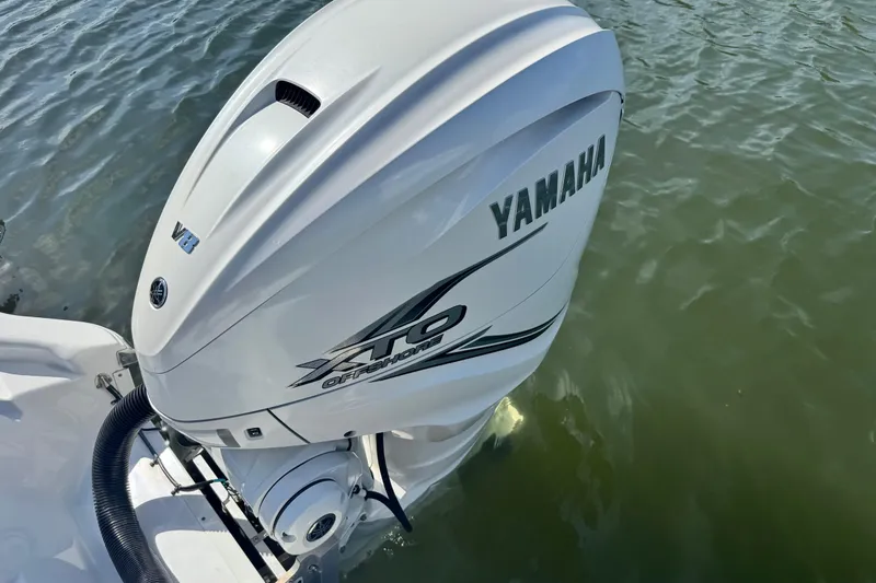 Slide: The Image of Yamaha XTO Offshore V8 engine on 2021 Sportsman Masters 267 Bay Boat in water. - 25