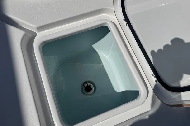 Slide: The Image of Livewell compartment on a 2021 Sportsman Masters 267 Bay Boat, filled with water. - 28