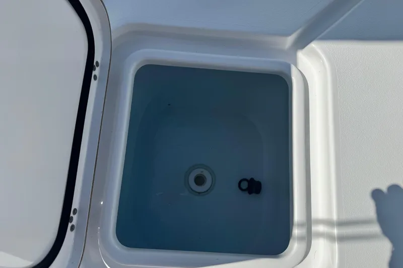 Slide: The Image of Livewell compartment on a 2021 Sportsman Masters 267 Bay Boat, open and empty. - 30