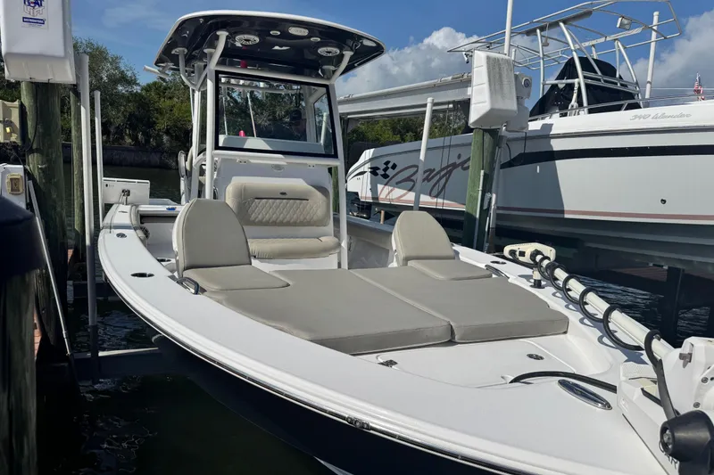 Slide: The Image of 2021 Sportsman Masters 267 Bay Boat docked, featuring spacious seating and sleek design. - 31