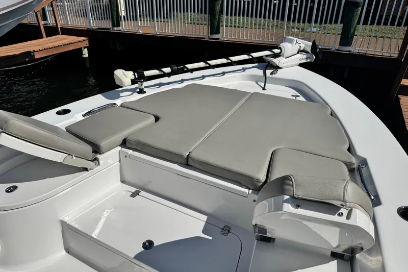 Slide: The Image of 2021 Sportsman Masters 267 Bay Boat with cushioned seating and trolling motor. - 32