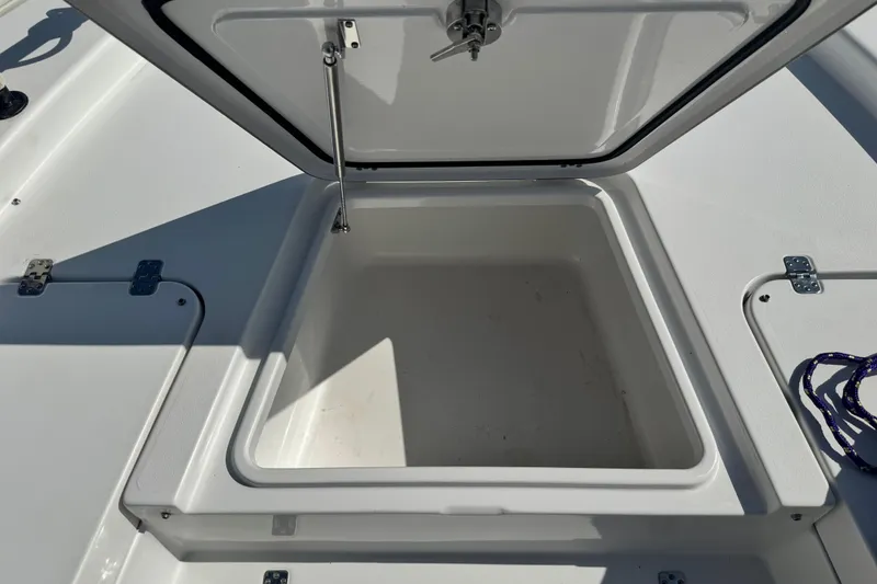 Slide: The Image of Open storage compartment on 2021 Sportsman Masters 267 Bay Boat. - 36