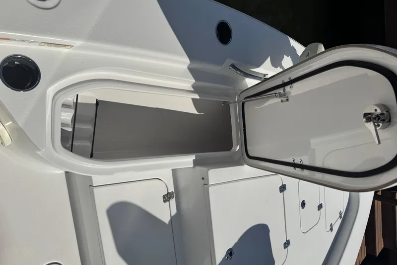 Slide: The Image of 2021 Sportsman Masters 267 Bay Boat open storage compartment on deck. - 38