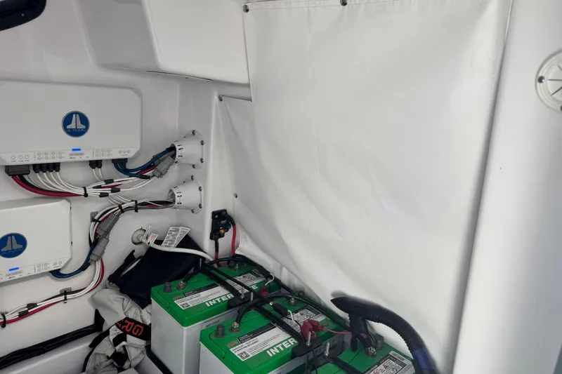 Slide: The Image of Interior view of a 2021 Sportsman Masters 267 Bay Boat's electrical system and batteries. - 45