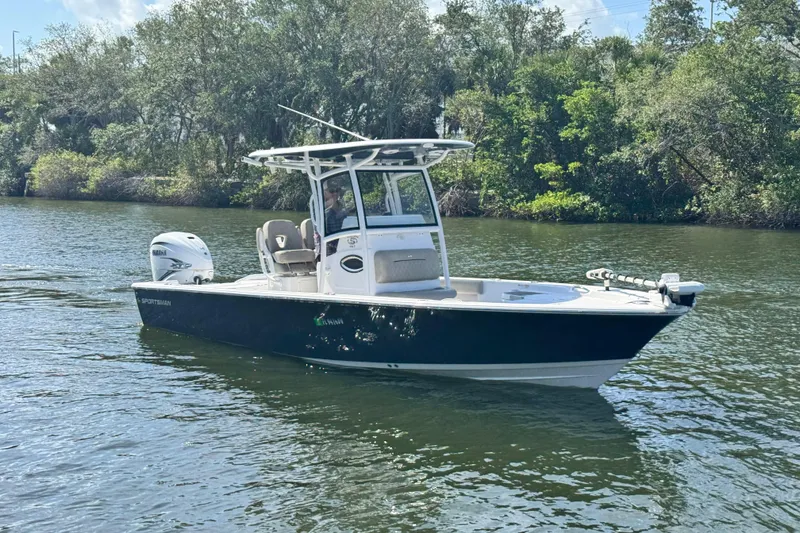 Slide: The Image of 2021 Sportsman Masters 267 Bay Boat cruising on a scenic river. - 5