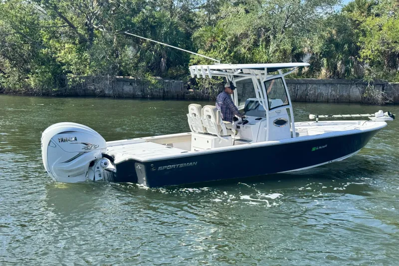 Slide: The Image of 2021 Sportsman Masters 267 Bay Boat cruising on a scenic waterway. - 6