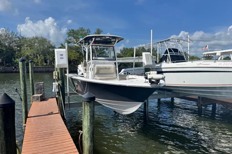 Slide: The Image of 2021 Sportsman Masters 267 Bay Boat docked on a sunny day. - 7
