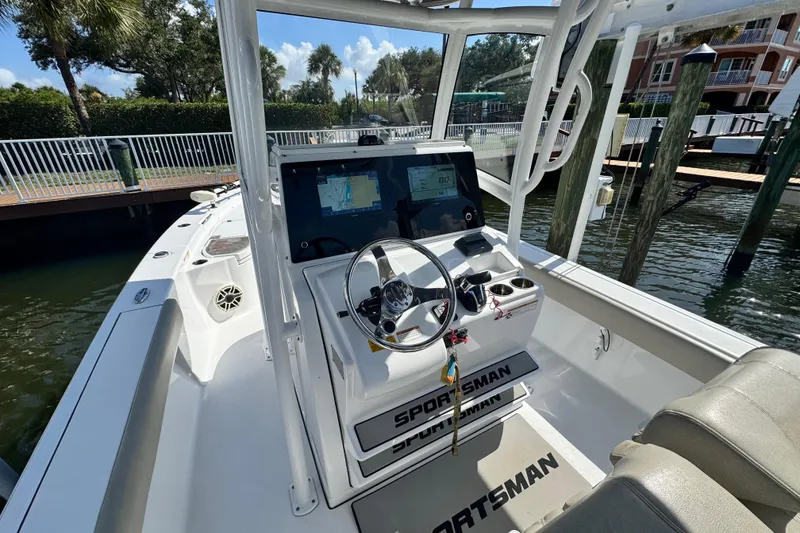 Slide: The Image of 2021 Sportsman Masters 267 Bay Boat cockpit with steering wheel and navigation display. - 9