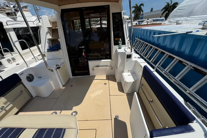 Slide: The Image of 2019 Ranger Tugs R-29 CB boat deck with seating and storage compartments. - 9