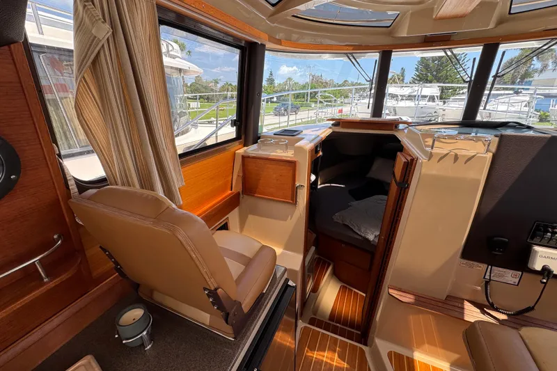 Slide: The Image of Interior of 2019 Ranger Tugs R-29 CB boat with helm, seating, and cabin view. - 28