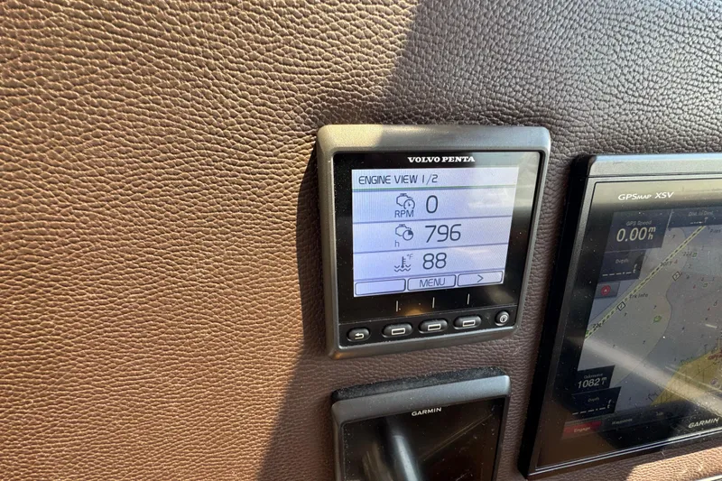 Slide: The Image of Volvo Penta engine display on 2019 Ranger Tugs R-29 CB dashboard, showing RPM and temperature. - 51