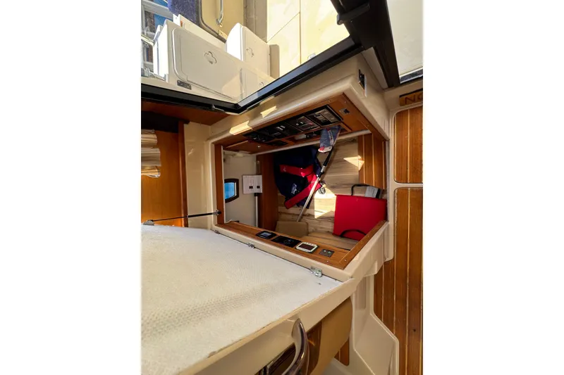 Slide: The Image of Interior view of 2019 Ranger Tugs R-29 CB boat, showcasing cabin and control panel. - 22