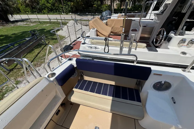 Slide: The Image of 2019 Ranger Tugs R-29 CB boat interior with seating and deck details. - 17